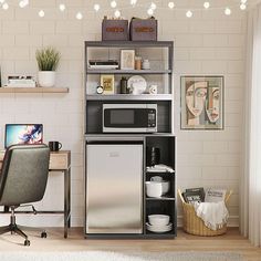 a microwave oven sitting on top of a wooden shelf next to a desk and chair