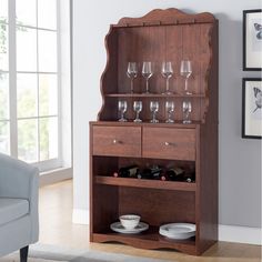 a wooden cabinet with wine glasses on it