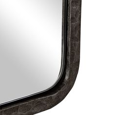 a mirror that is on the side of a wall with a black frame and silver trim