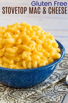 a blue bowl filled with macaroni and cheese