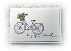 a birthday card with a bicycle and flowers