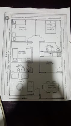 the floor plan for an apartment is shown on top of a piece of white paper