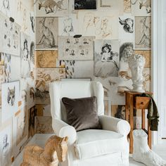 a white chair sitting next to a wooden rocking horse