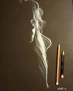 a pencil drawing of a woman with long hair