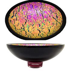 a black bowl with purple and yellow designs on it