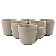 six coffee mugs are lined up in the same row and one is empty on the other side