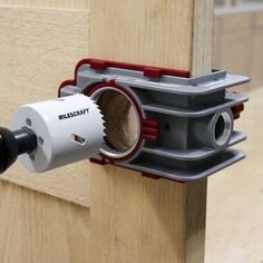 a drill is attached to the side of a door