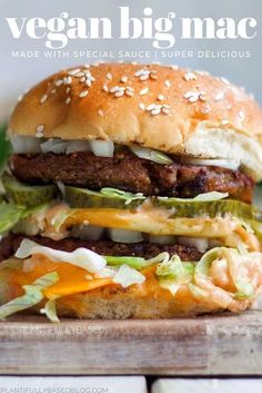 a hamburger with cheese, lettuce and other toppings