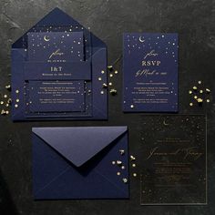 wedding stationery with gold confetti on dark blue paper and black envelopes