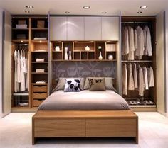 a bedroom with a bed and closets in it