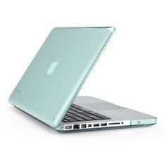 an open apple laptop computer sitting on top of a white table next to a gray wall