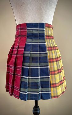 A high-waited miniskirt featuring THREE different tartan plaid patterns. Side zipper closure.  US Size S/4  ( 28" waist) Beginner Tailoring, Unusual Clothes, Clothes Making, Womens Skirts, Tartan Plaid, Plaid Pattern, Side Zipper, Tartan, Art Collection