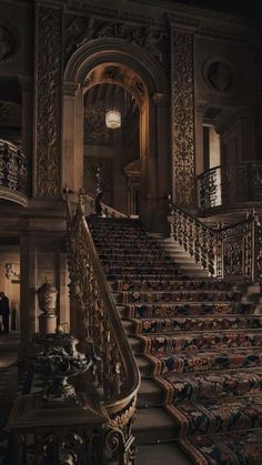 an ornate stair case in the middle of a building