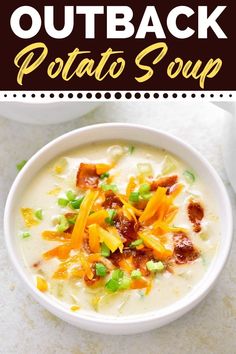 a bowl of potato soup with bacon, cheese and green onions