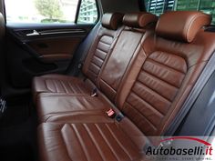 the interior of a car with brown leather seats