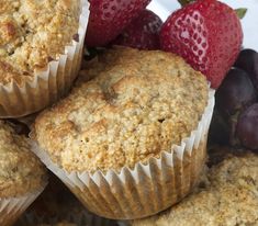 some muffins and strawberries on a plate