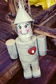 a tin can doll with a heart on it