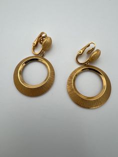 Vintage Trifari brushed gold hoop dangle earrings In very good condition  Measure 1.75" long  2024 Hoop Dangle Earrings, Vintage Trifari, Etsy Earrings Dangle, Gold Hoop, Clip On Earrings, Dangle Earrings, Jewelry Earrings, Accessory Gift, Electronic Accessories