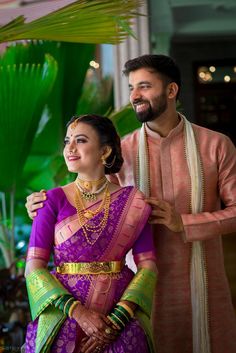 Photo of A Marathi color-coordinated couple on their wedding day Engagement Dress For Marathi Couple, Marathi Engagement Look Couple, Maharashtrian Engagement Couple Dress, Marathi Engagement Look, Nauvari Saree Couple Photoshoot, Marathi Cupels Photo, Saree With Gold Jewellery, Marathi Couple Photo, Purple Lehenga Color Combos