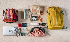 the contents of a backpack laid out on the floor