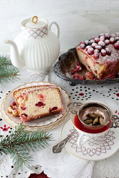 a piece of cake sitting on top of a plate next to a cup and saucer