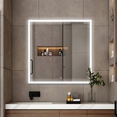 a bathroom with a sink, mirror and lights on the wall above it's counter