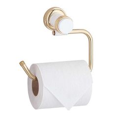 a gold toilet paper holder with two rolls of toilet paper