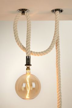 a light fixture with rope wrapped around it's bulb and two lights on each side