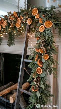 a ladder decorated with orange slices and greenery