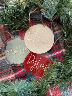 two christmas ornament hanging from a tree with the word, holiday diy on it