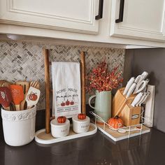 kitchen utensils are sitting on the counter