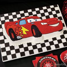 a birthday cake with cars on it