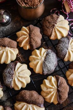 chocolate cookies with white frosting on a cooling rack