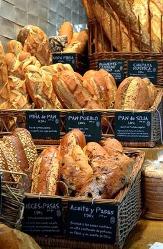 many different types of bread in baskets