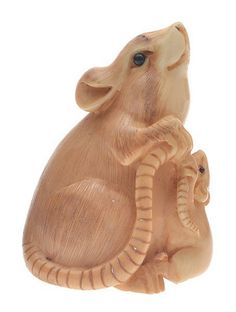 an elephant figurine sitting on top of a baby elephant's back with it's trunk in the air