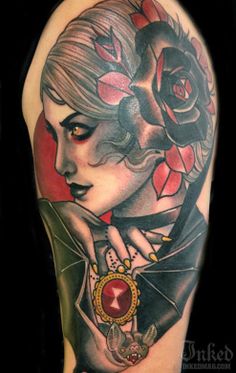 a woman with flowers on her head and an ornate frame around her neck is shown in this tattoo design