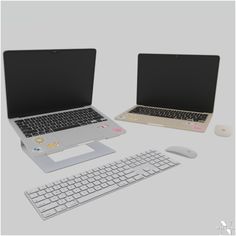 an open laptop computer sitting on top of a desk next to a keyboard and mouse