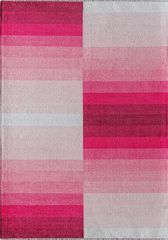 a pink and white checkered rug on top of a wooden floor