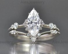 an engagement ring with a pear shaped diamond