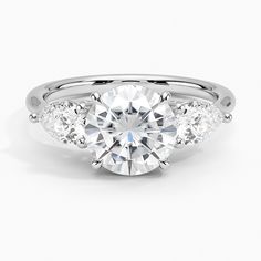 three stone engagement ring with diamonds on the side