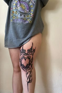 a woman with a tattoo on her leg