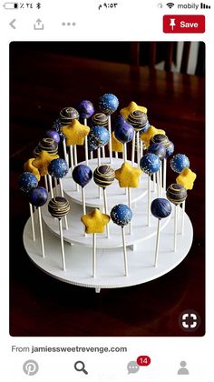 an image of cake pops on a plate with stars and planets in the top one