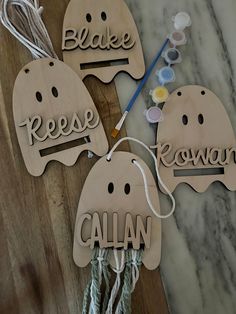 three wooden tags with the words reese, removable and callan written on them