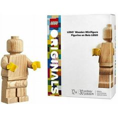 a wooden figure next to a box of lego minifigures