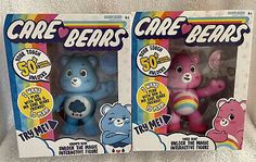 two care bears toys are in their boxes