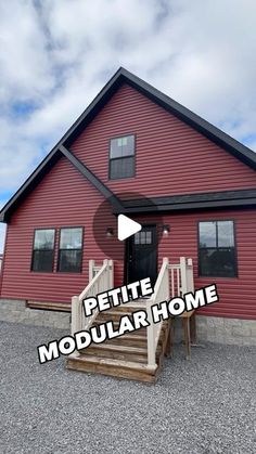 a red house with the words petite modular home on it's front porch