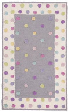 a rug with multicolored dots on it