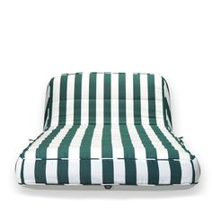 a green and white striped couch on a white background