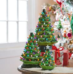 a small christmas tree sitting on top of a table