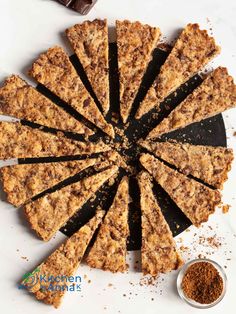 an overhead view of a chocolate and oatmeal cake with slices cut out